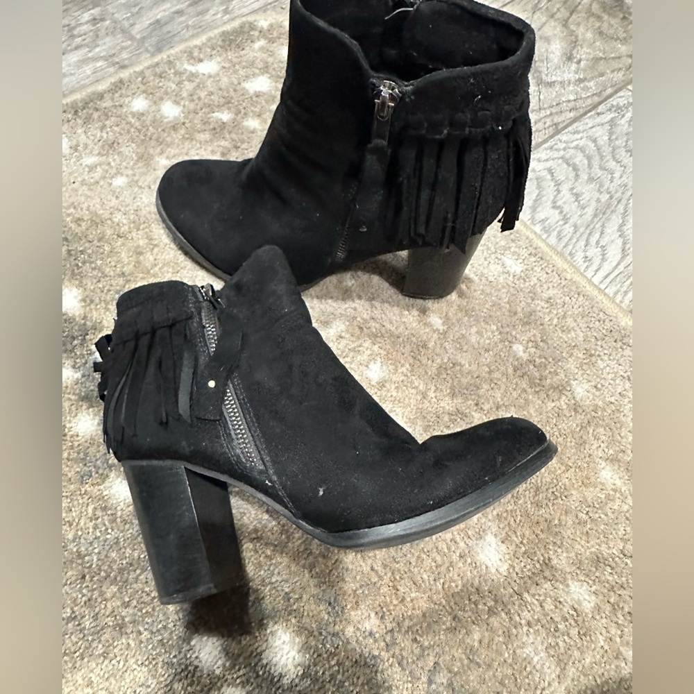 Well worn black fringe suede boot